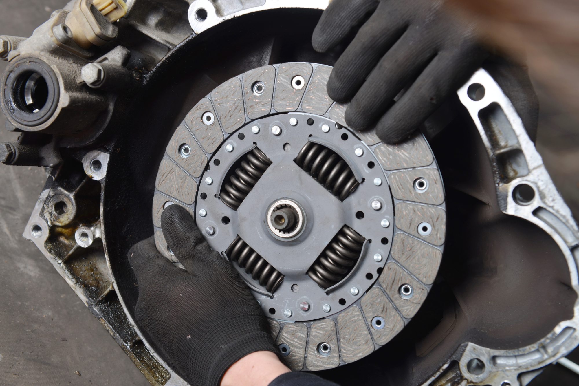 Vehicle Clutch, Car mechanic is changing Clutch in the workshop